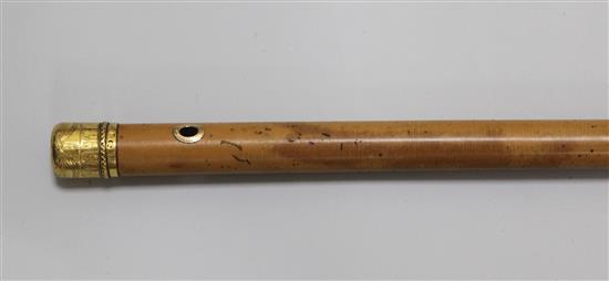 A 22ct gold mounted malacca cane dated 1774 by Lawrence Johnson,